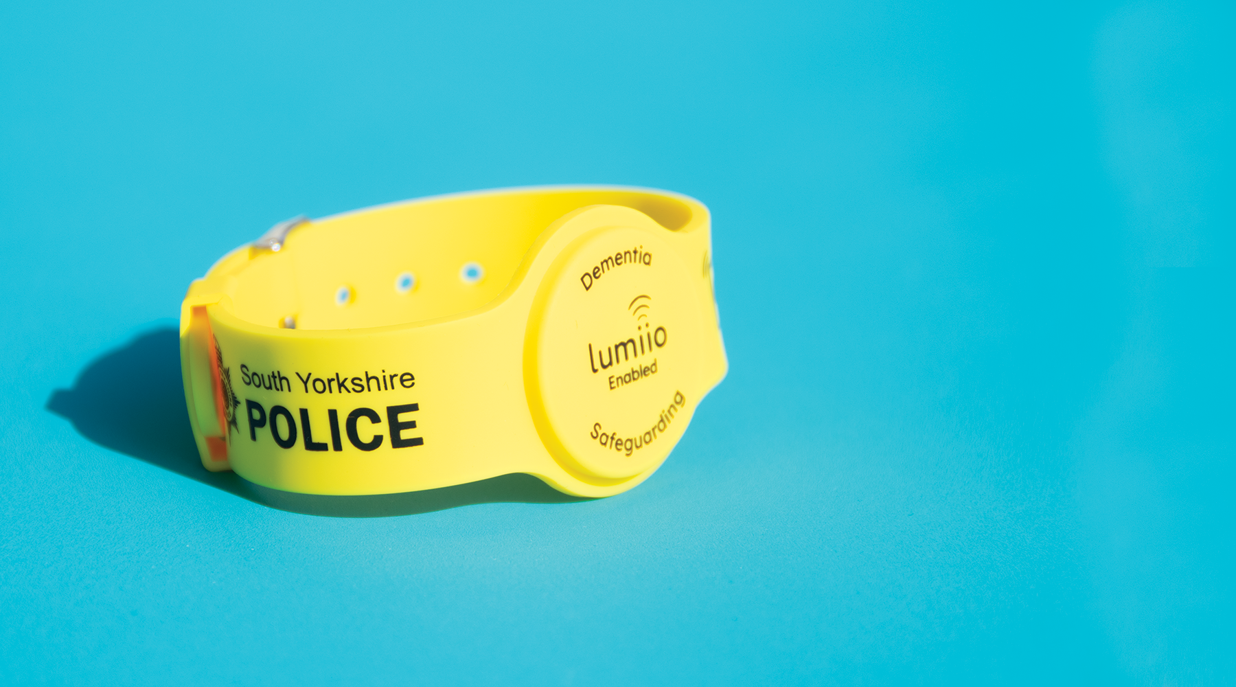 South Yorkshire Dementia Wristband against blue background, powered by Lumiio
